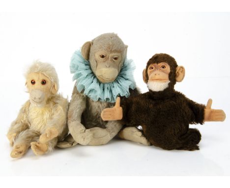A Steiff pre-war chimpanzee, with faded brown mohair, clear and black glass eyes with brown backs, felt face, ears, hands and