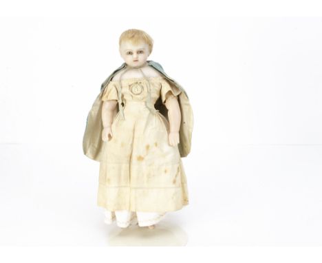 An English poured pale wax shoulder-head doll,  with blue glass eyes, inset blonde hair, stuffed body with wax limbs, white c