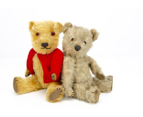 Two post-war Chiltern teddy bears,  with golden mohair, replaced glass eyes, muzzle with black stitched nose, mouth and claws