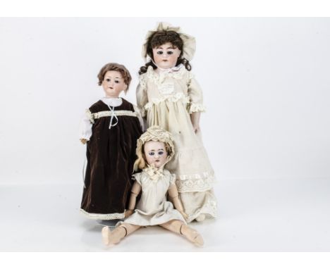 Three Armand Marseille child dolls,  an Alma shoulder-head with kid Universal jointed body, bisque arms and recent dress --25