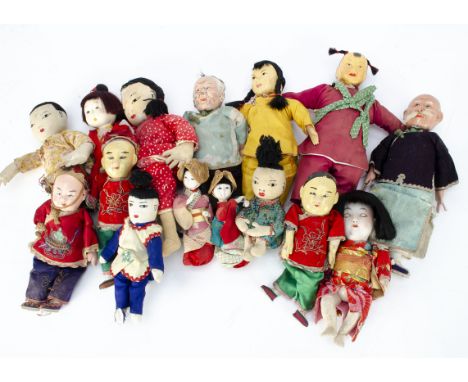 A quantity of Chinese and Japanese dolls, including a Japanese bisque headed baby in kimono --7 ¾in. (19.5cm.) high; a compos