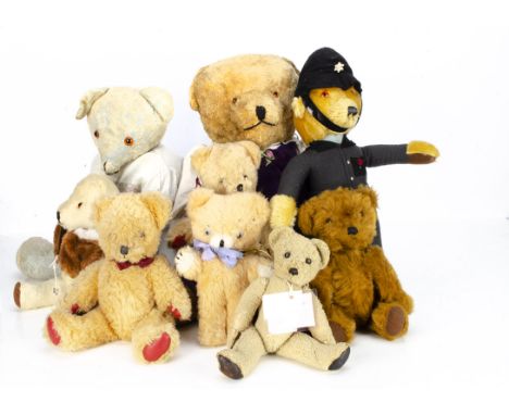 Nine post-war British teddy bears,  a Merrythought policeman --18 ½in. (47cm.) high; two late Alpha Farnell Dralon bear, one 