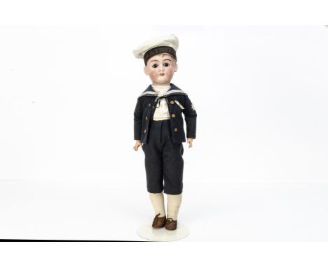 A Max Handwerck child doll,  with brown sleeping eyes, strawberry blonde hair wig, jointed composition body, blue wool sailor