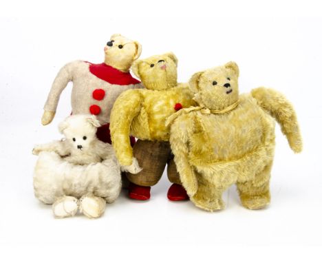 Four unusual teddy bears, a replica of a Strunz muff teddy bear --13in. (33cm.) high; two other bears made using old cloth do