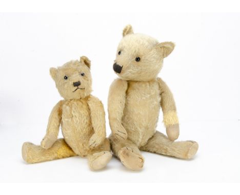Two 1930s Chiltern-type teddy bears,  both with swivel heads and jointed limbs, the larger with blonde mohair, replaced black