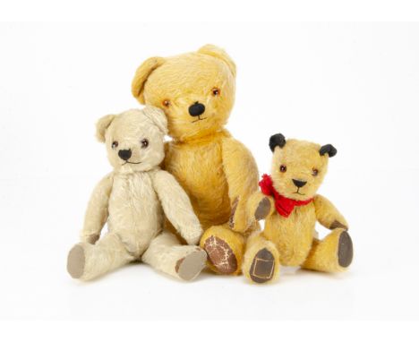 Three post-war Chad Valley teddy bears,  a Sooty type with golden mohair, black ears, orange and black glass eyes, black stit