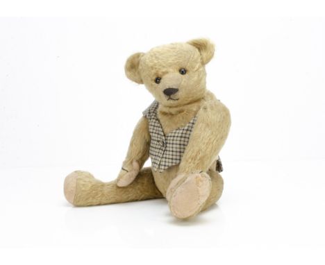 'Humpy' an early American teddy bear circa 1910,  with golden mohair, black boot button eyes, pronounced muzzle, black stitch