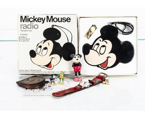 Disney's Mickey Mouse, an enamelled Mickey Mouse Club button hole pin; a celluloid Mickey; a china candle holder; a Timex wat