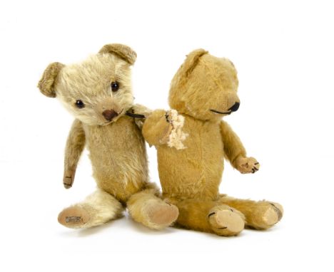 Two  Merrythought teddy bears,  a 1930s bear with golden mohair, orange and black glass eyes, muzzle with black stitched nose