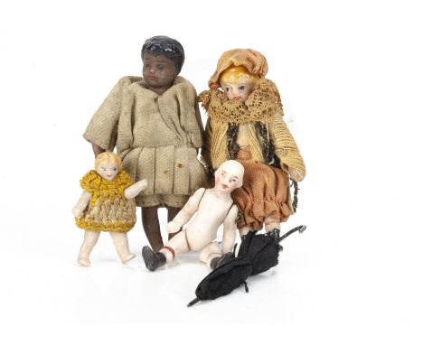 A French Lilliputian black dolls' house doll, with black painted hair, socket head with stringing loop, jointed at shoulders 