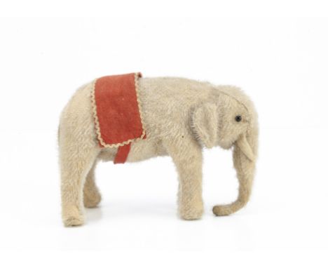 A small German mohair elephant 1910-20s,  similar to Steiff with grey mohair, black boot button eyes with white felt behind, 