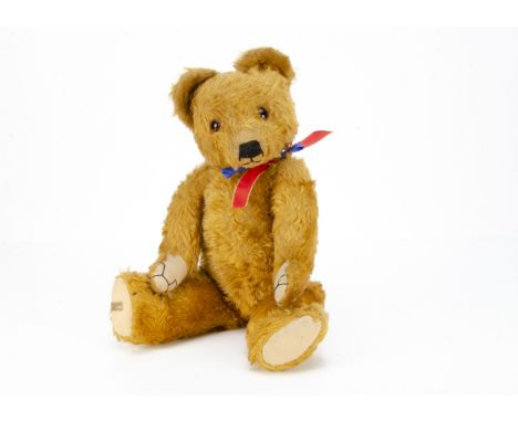 A good Merrythought teddy bear 1950s,  with dark golden mohair, orange and black glass eyes, pronounced clipped muzzle, black