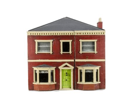 A late 19th century carpenter built dolls' house,  with red brick exterior, white painted stone work, central green front doo