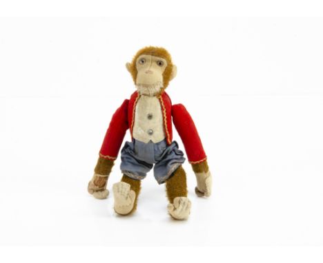 A Bing clockwork Tumbler Monkey 1910-20s,  with felt faces, ears and hands, brown and black glass eyes, brown mohair head and