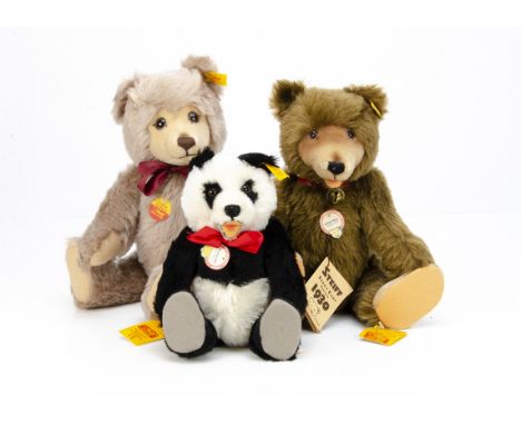  Three Steiff yellow tagged teddy bears, a brown Teddy Baby replica --14 ½in. (37cm.) high; an Original Teddy Bear with mask 