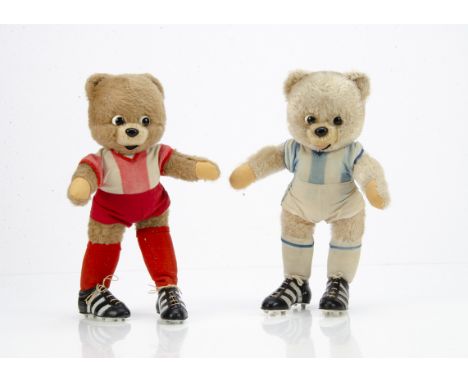 Two Schuco bigo-bello teddy bear footballers,  with beige mohair,  black and white plastic eyes, black plastic nose, wired li