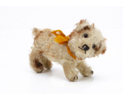 A Steiff standing Molly dog late 1920s, with white and brown tipped mohair, brown and black glass eyes, black stitched nose, 
