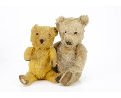 Two post-war Chiltern Hugmee teddy bears,  one with blonde mohair, orange and black glass eyes, black stitched nose, mouth an