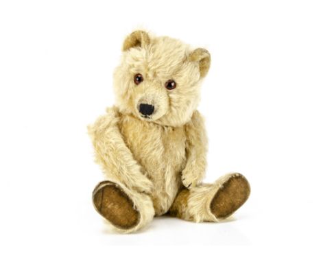 A Chiltern Ting-a-Ling teddy bear late 1950s,  with unusual light golden mohair, orange and black glass eyes, inset short moh