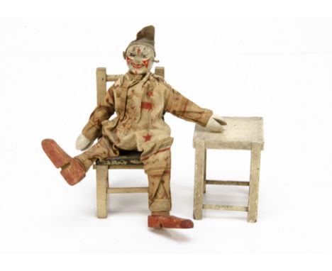 A larger Schoenhut Circus clown, with printed costume --8in. (20.5cm.) high; a chair and a stool (some wear and staining) 