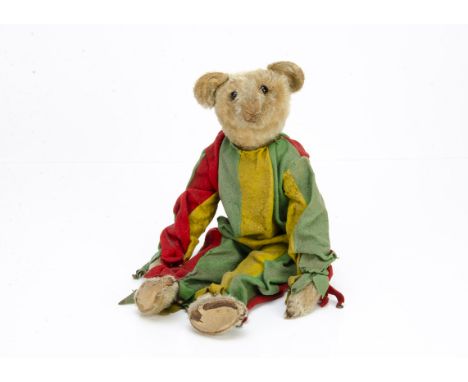 A very rare and early Strunz jester teddy bear circa 1904,  probably rod jointed with blonde mohair head, hands and feet, bla