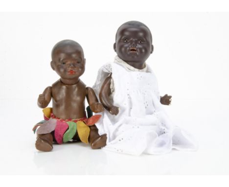 Two black baby dolls, an Ernst Heubach bisque headed 399 with dark sleeping eyes, broad nose, full lipped closed mouth, pierc