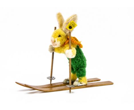 A rare Steiff pom-pom woollen skiing rabbit (Skihas 17) 1936-40, with brown and black glass eyes, pom-pom yellow and white ra