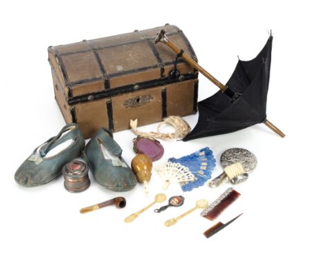 Doll's accessories, a small doll's domed trunk covered in brown cloth and black oil-cloth banding --7in. (18cm.) wide; an umb