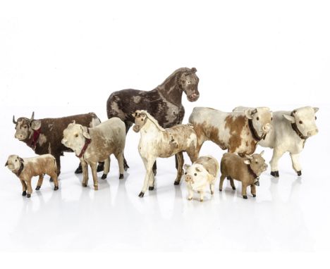 Nine skin covered farm yard animals,  two bullocks --5 ½in. (14cm.) long, a pony and a pig, smaller scale bullock, cow, calf 