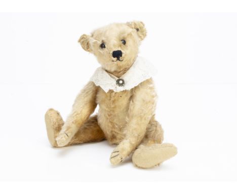 'Goldie' an early Steiff teddy bear with blank button circa 1905,  with apricot golden mohair, boot button eyes, pronounced m