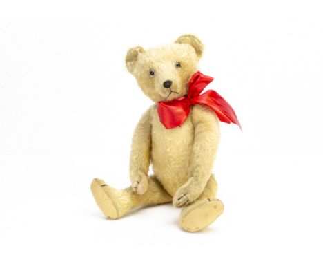 'Baron Crämer' a German teddy bear 1920s,  with light golden mohair, clear and black glass eyes, remains of brown painted bac