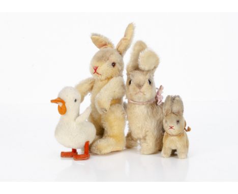 Post-war German rabbits and duckling, a fully jointed rabbit with orange and black glass eyes, red stitched nose and mouth --