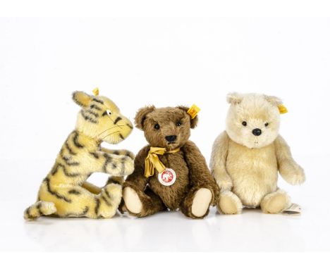 A Steiff yellow tagged Winnie the Pooh,  with joints --10in. (25.5cm.) high; a Tigger; and a brown jointed teddy bear
