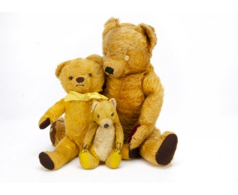 Two Merrythought teddy bears, a unusual yellow artificial silk plush seated teddy bear with white artsilk ear lining, muzzle 