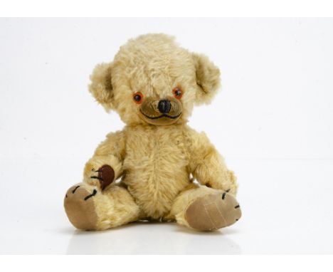 A Merrythought Cheeky teddy bear 1960s, with golden mohair, orange and black plastic eyes, inset velvet  muzzle, black stitch