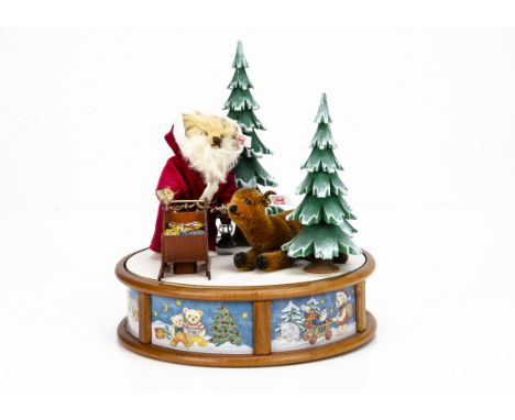 A Steiff limited edition Christmas musical box 2003, 249 of 1000 --10 ½in. (27cm.) high (missing box and certificate