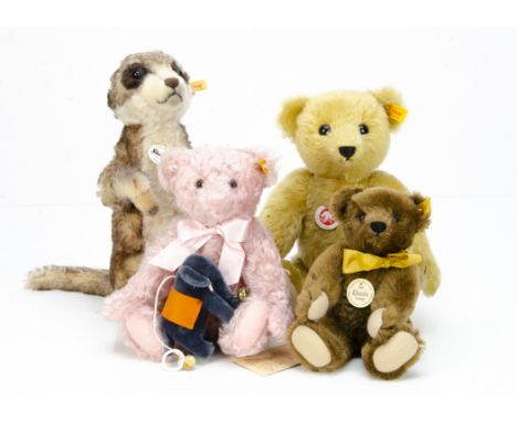 Three Steiff yellow tagged teddy bears, and a Mungo meercat --12 ½in. (32cm.) high; and a Steiff Club gift crib elephant