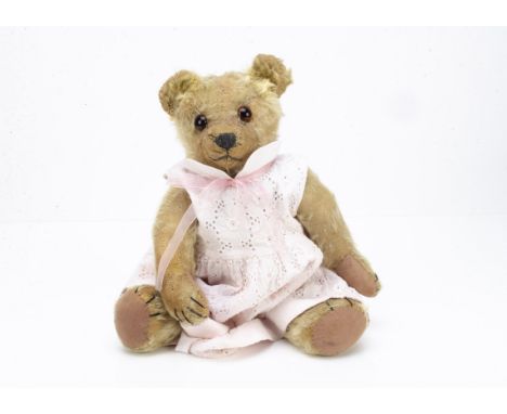 'Ruby' an early Chad Valley teddy bear 1915-20, with blonde mohair, replaced orange and black glass eyes, pronounced clipped 