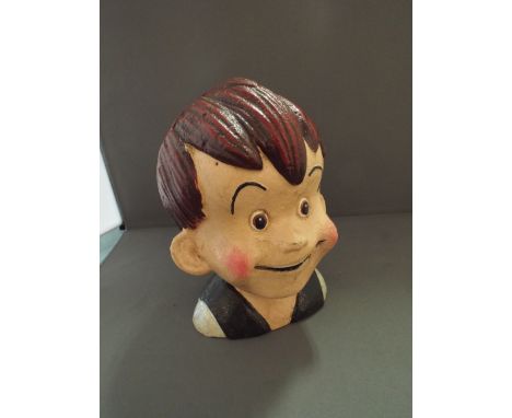 A Cast Metal Novelty Money Bank in the form of A Boy (item 29, plus VAT) 
