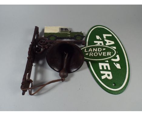 A Cast Metal Door Bell with Land Rover Motif together with Two Oval Reproduction Land Rover Signs (item 43, plus VAT)