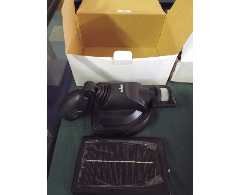 A Solar Rechargeable Garage Wall Light (item 11, plus VAT)