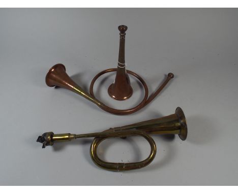A Collection of Three Copper and Brass Hunting and Car Horns 