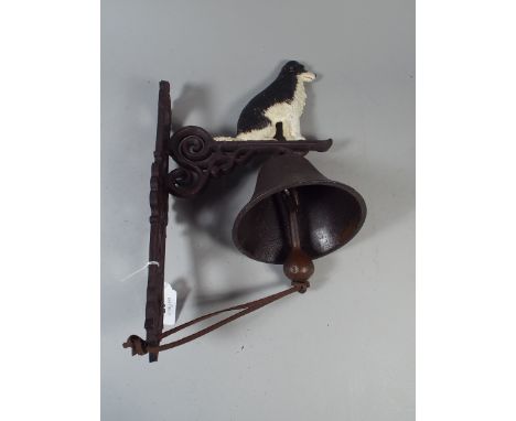 A Cast Metal Wall Hanging Door Bell with Sheep Dog Motif (item 36, plus VAT) 