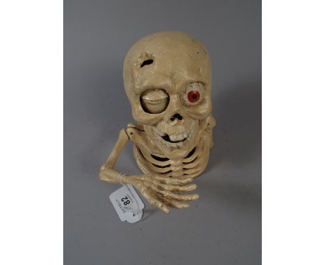 A Cast Metal Reproduction Novelty Money Bank in the Form of A Skull (item 27, plus VAT)