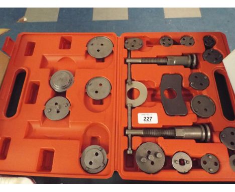 A Cased Brake Caliper Rewind Kit (item 12, plus VAT) 
