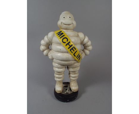 A Large Cast Metal Michelin Man Modelled as Standing on Tyre (item 44, Plus VAT)