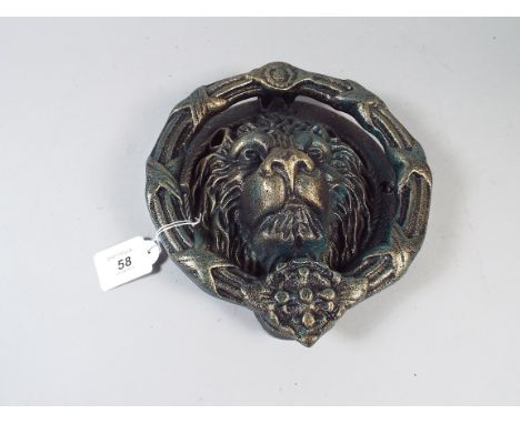 A Cast Metal Lion Mask and Ring Door Knocker (item 35, plus VAT)