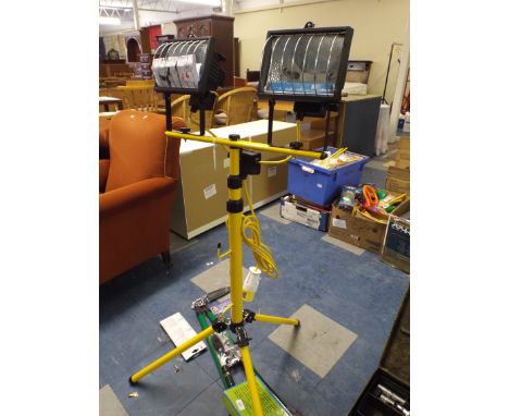 A 110 Volt Twin Halogen Tripod Light (item 6, plus VAT)