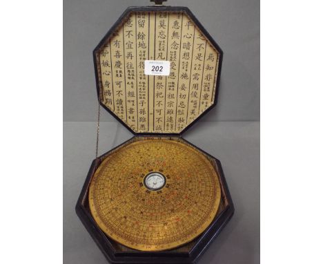 A Reproduction Oriental Calendar/Compass in Lacquer Effect Box