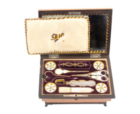 A satinwood Palais Royal sewing box circa 1840, the ogee sides below an undulating lid with central ebonised panel mounted wi